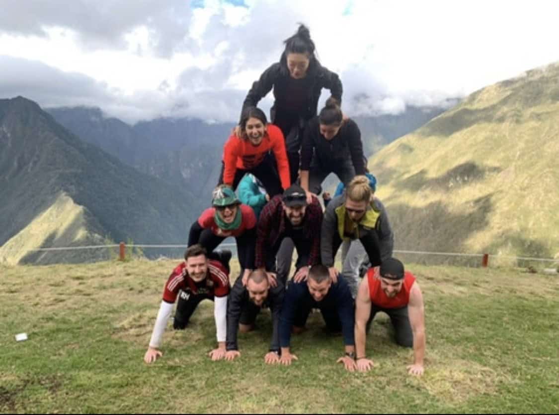 group of people creating a human pyramid