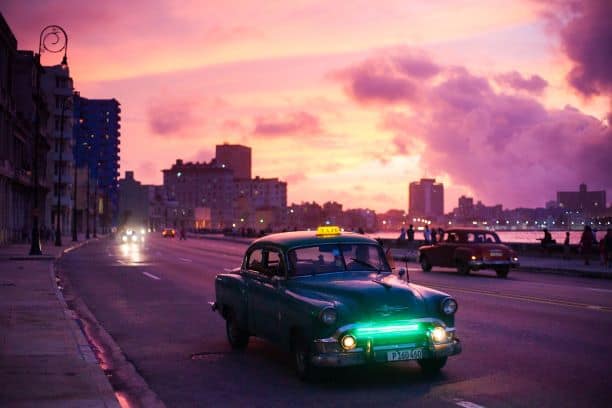 Interesting facts about Havana Cuba: Classic American car in a colorful sunset in Havana