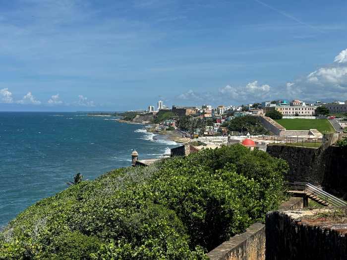 Views of San juan from the old fortress in the city towards the historic part of the city along the green shores