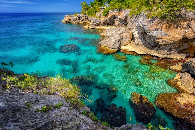 Crystal clear waters below the cliff in Negril West End