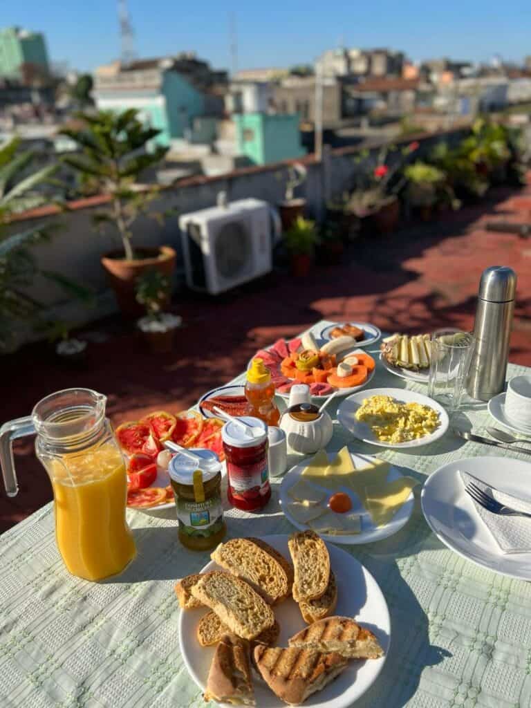 Breakfast at the rooftop terrace on my casa particular in Santa Clara, Cuba, a huge table with a lot of cheese, fruits, bead, and of course, coffee! 