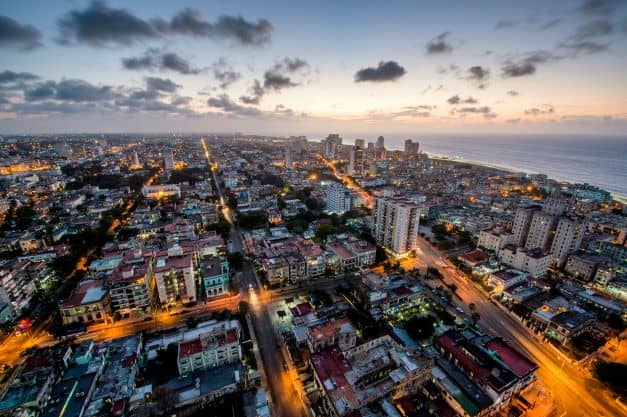 Night aerial photo of Vedado district in Havana at night with lit streets and buildings