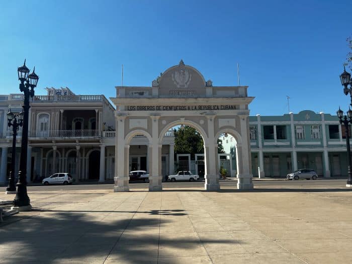 The Cuban version of the Arche de Triomphe in Cienfuegos Cuba in a smaller scale, a white archway in Cienfuegos main square on a sunny summer day