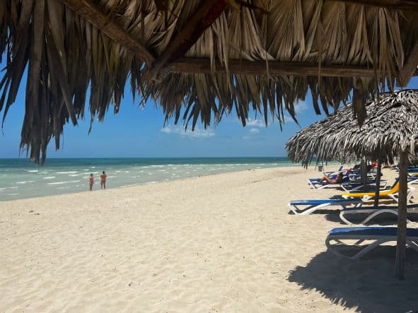 The light golden sandy beach on a bright sunny day outside Playa Alameda resort beach in Varadero. 