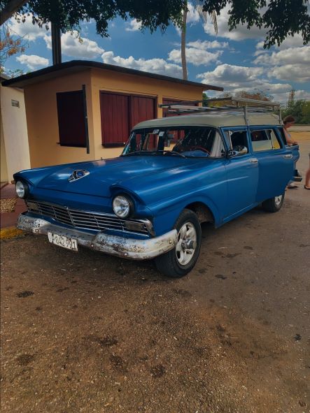 An old blue Classic American car taxi that I took from Havana to Trinidad, not one of the most elegant ones, a bit rusty, but it got us there. 