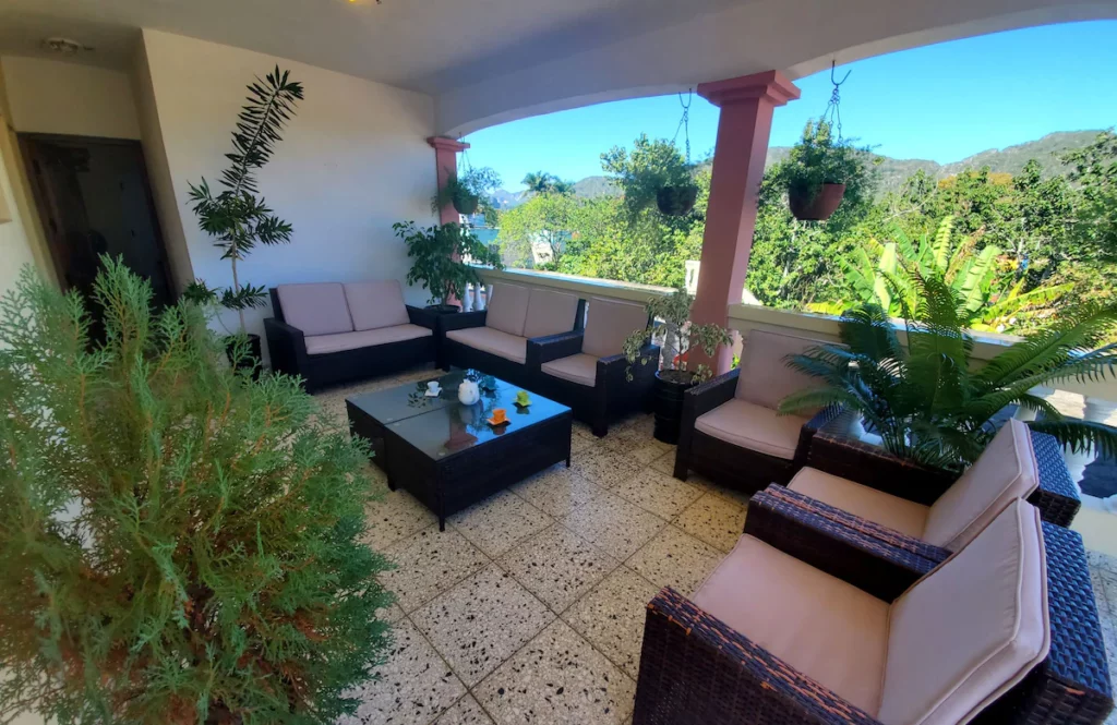 The airy elegant terrace in Casa Los Rubios in Vinales with wonderful views of the valley