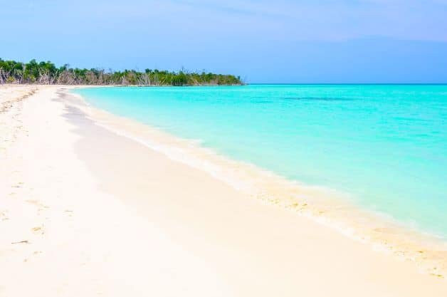 The paradisiacal white beach with light blue water on Cayo Levisa in Cuba