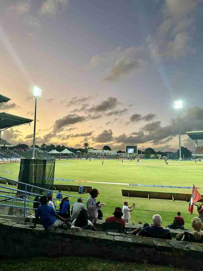 Do as the locals and go see a cricket match on the large stadium with wide green fields, great ambiance, lots of spectators, and if you are lucky, a glowing sunset like in this photo