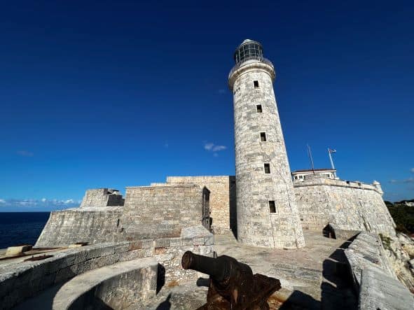 El Morro lighthouse outside Havana Cuba, build on the fortress guarding Havana with grey rock sitting right on the Atlantic Ocean. 