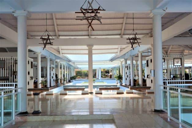 The beautiful white airy foyer at the Melia Paradisus in Varadero Cuba with shiny tiles and massive white columns, one of my favorite resorts in Varadero! 