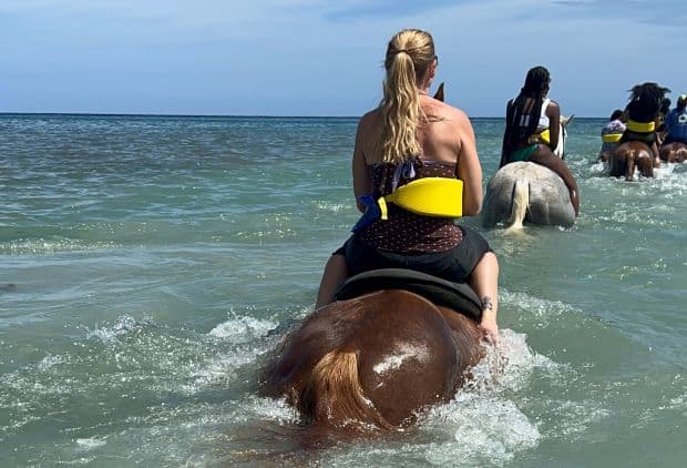 Swimming with horses (well, the horses are swimming, I am riding) from the beach in Ocho Rios, the water crystal clear, and the day beautiful with sun and blue skies. 