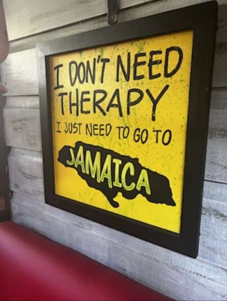A yellow photo in a black frame with the text "I dont need therapy, I just need to go to Jamaica"!