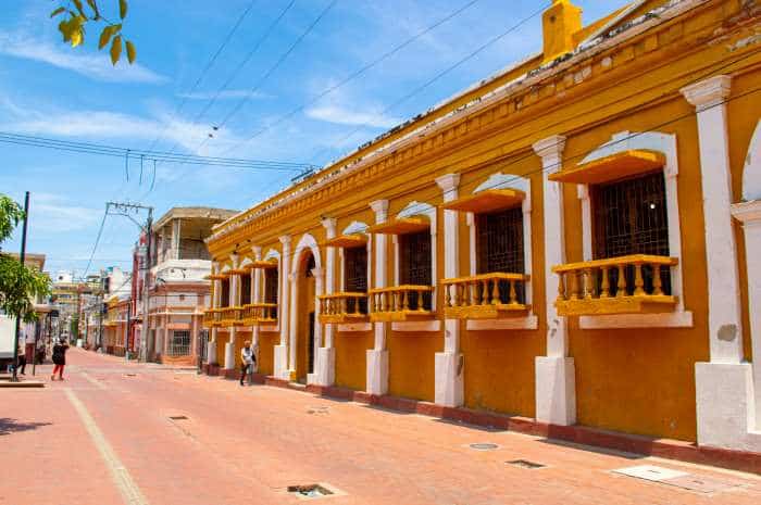 A bright orange classic colonial house in Las Bovedas neighborhood in Cartagena Colombia. 