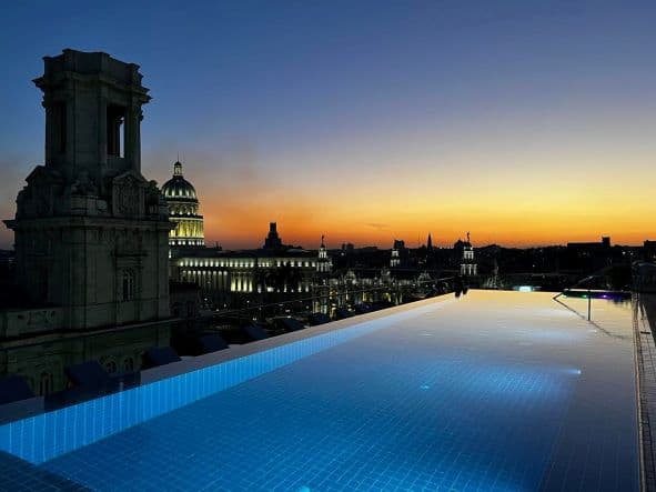 View from the pool on top of Manzana Kempinski Hotel at night, right after sunset. The glow is still on the horizon. 
