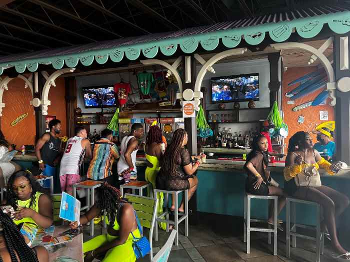 Colorful and vibrant Margaritaville in Montego Bay with lots of people enjoying the evening with music and drinks