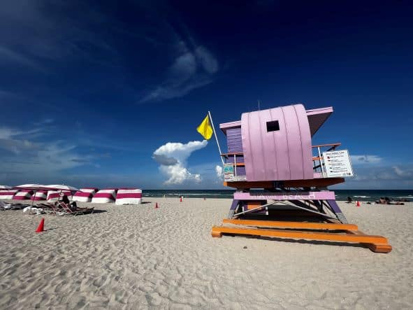 A bright pink lifeguard station in Miami Beach on a sunny summer day