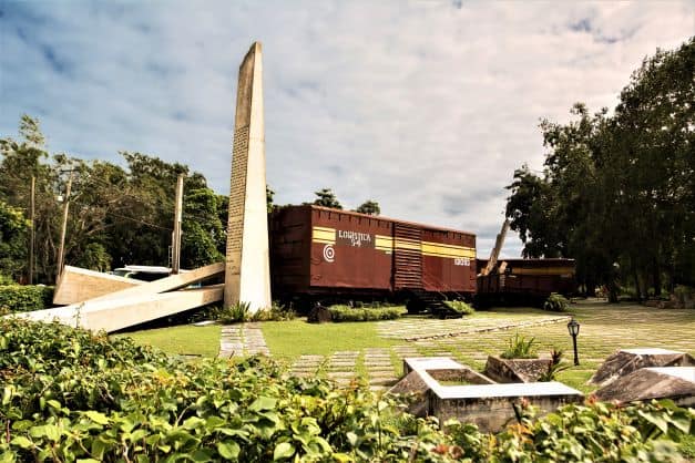 An important incident in the battles before the Cuban Revolution was the derailing of a train with soldiers and ammunition from Havana. This memorial has a red train coach and a big memorial plaque in a green park. 