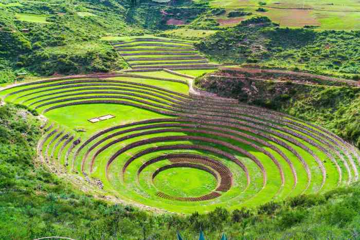 The fascinating circle structures made of nature rock with green grass in between in Moray, in the sacred Valley of the Incas, on a sunny day. 