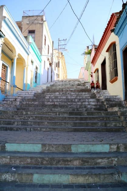 The Padre Pico steps in Santiago, a stone stairway in a tiny alleyway with colorful colonial houses on each side. 