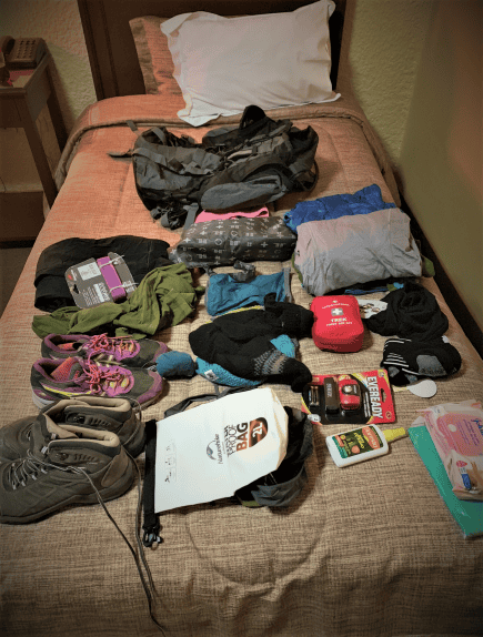 All my clothes and gear that I want to bring on the Inca Trail laid out on my bed, in the process of packing. 