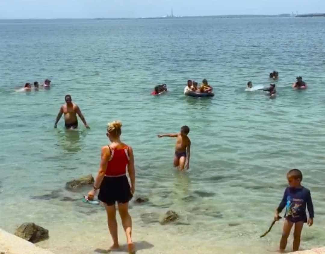 Me walking into the water in Cienfuegos Cuba, where lots of people enjoy playing in the greenish crystal clear and calm water