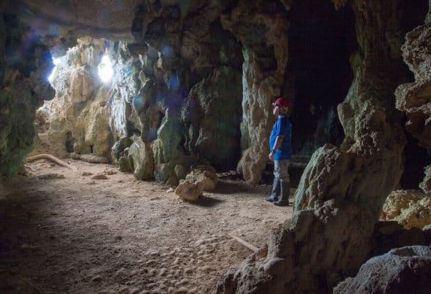 The famous Santo Tomas cave in Vinales, with sandy floors and rock formations on the walls and rugged ceilings, with light sifting in from the outside