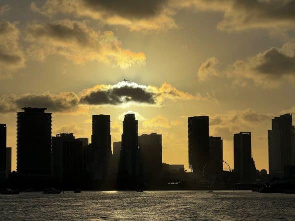 From the sunset cruise I did on Biscayne Bay, heading back to shore part of the miami skyline is in dark relieff to the golden sky behind it