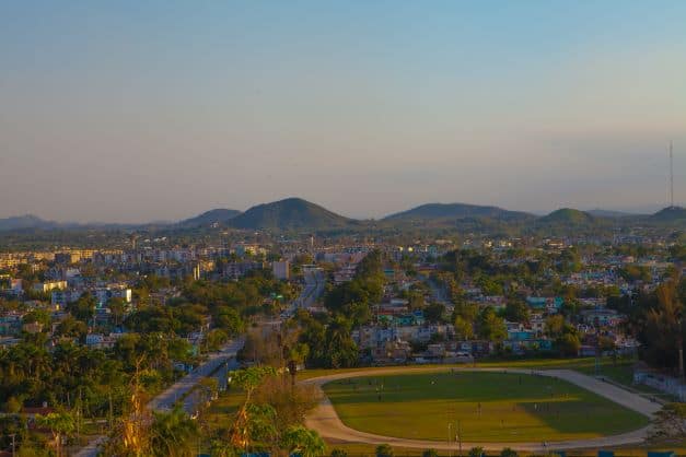 The vast green view of Santa Clara town below La Loma hill right before sunset