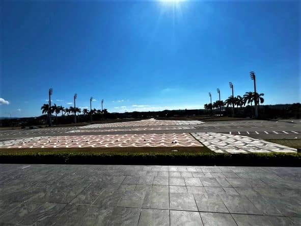 The huge Plaza de la Revolucion in Santa Clara on an early morning when the sun is already high in the blue sky. 