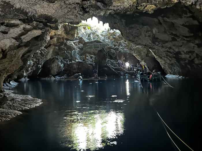 Los Tres Ojos is a cave system you should definitely visit in Santo Domingo. The caves are partly open partly covered, and you need to take a boat in the cave from one side to the other on the still blank water in the dark. 
