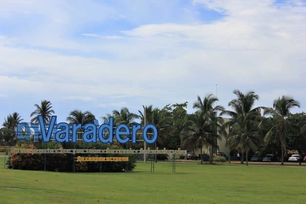 The entrance to Varadero Airport with a blue sign saying Varadero. 