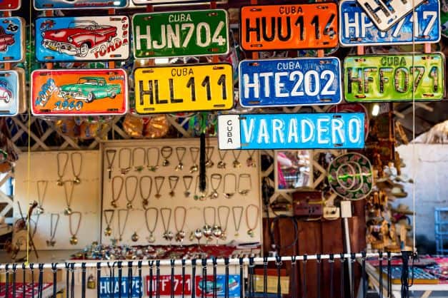 A stall selling old colorful car plates with Cuba insignia in Varadero