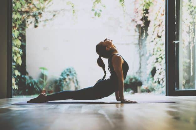 I found this stunning photo of a woman doing yoga, standing in an upward dog in a room with the wide doors open to the garden. This is yoga as it should be, and it can easily be like this in Jamaica!