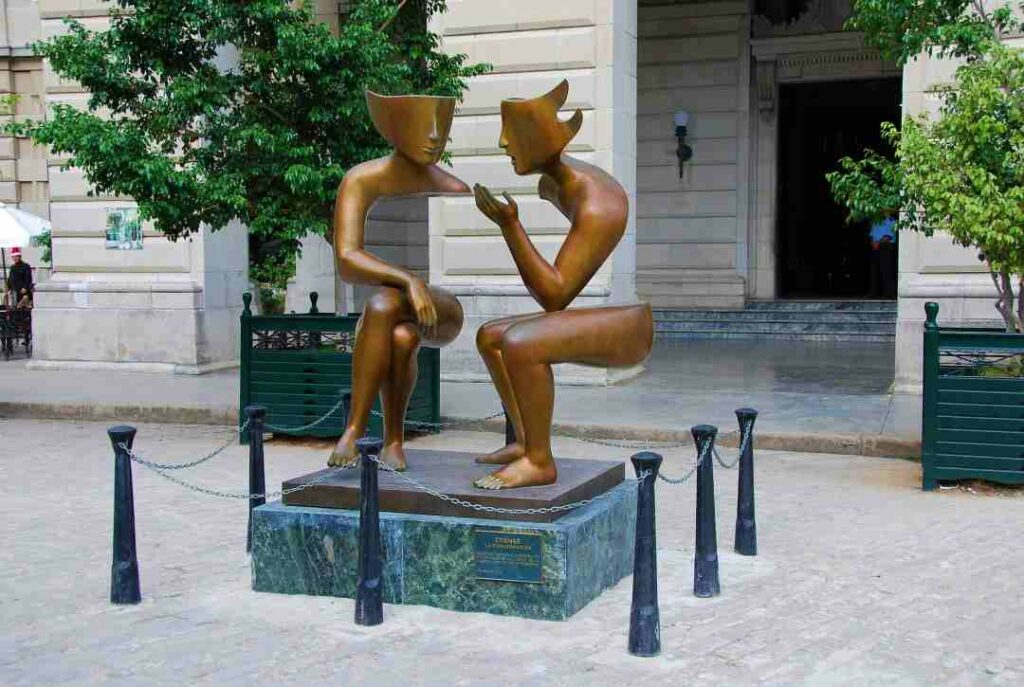 Bronze statues in Havana Cuba outside a white colonial building in the old city