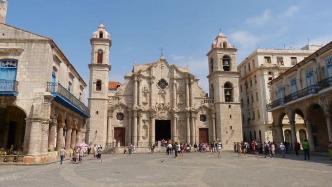 The wide Plaza de la Catedral in Havana Cuba. The cathedral is at the far side of the photo, and the square is also surrounded by museums and other classic colonial elegant buildings. 