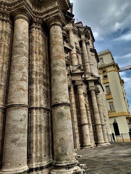 Huge stone columns on both sides of the main entrance to San Cristobal Cathedral in Old Havana, Cuba. 