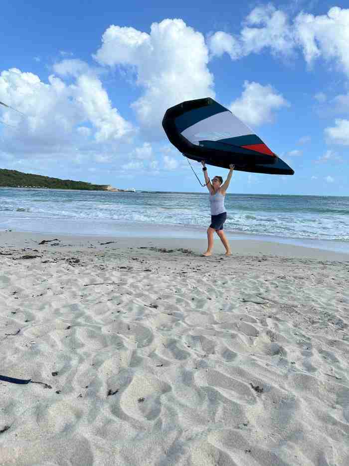 Head down to this white sandy beach and learn how to wind foil! Run with the foil on the beach along the water until you get the hang of it. 