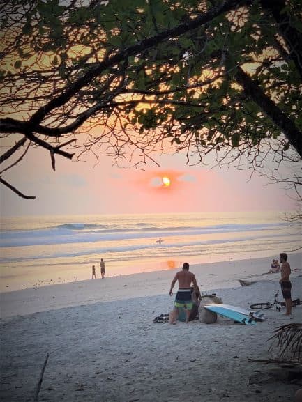 Beautiful sunset on the beach in Costa Rica, the horizon is glowing orange and red