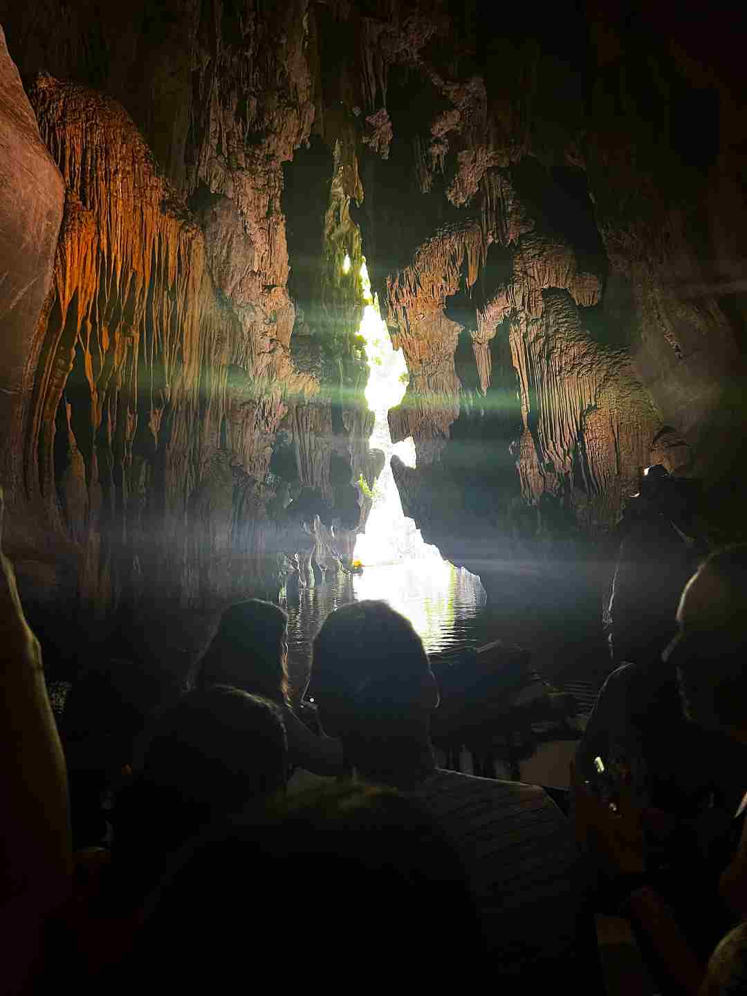 Cueva del Indio river and boat trip, you see the spectacular stalagmits and stalactites in the ceiling over the boat, and the exit of the cave at the end of the river ahead