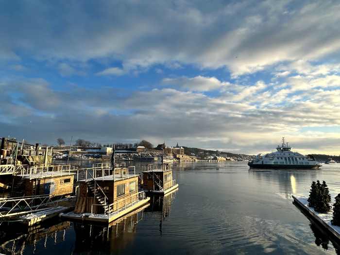 Small wooden floating saunas on the water at Aker Brygge, Oslo, i the inner harbor of the Norwegian capital on a sunny day