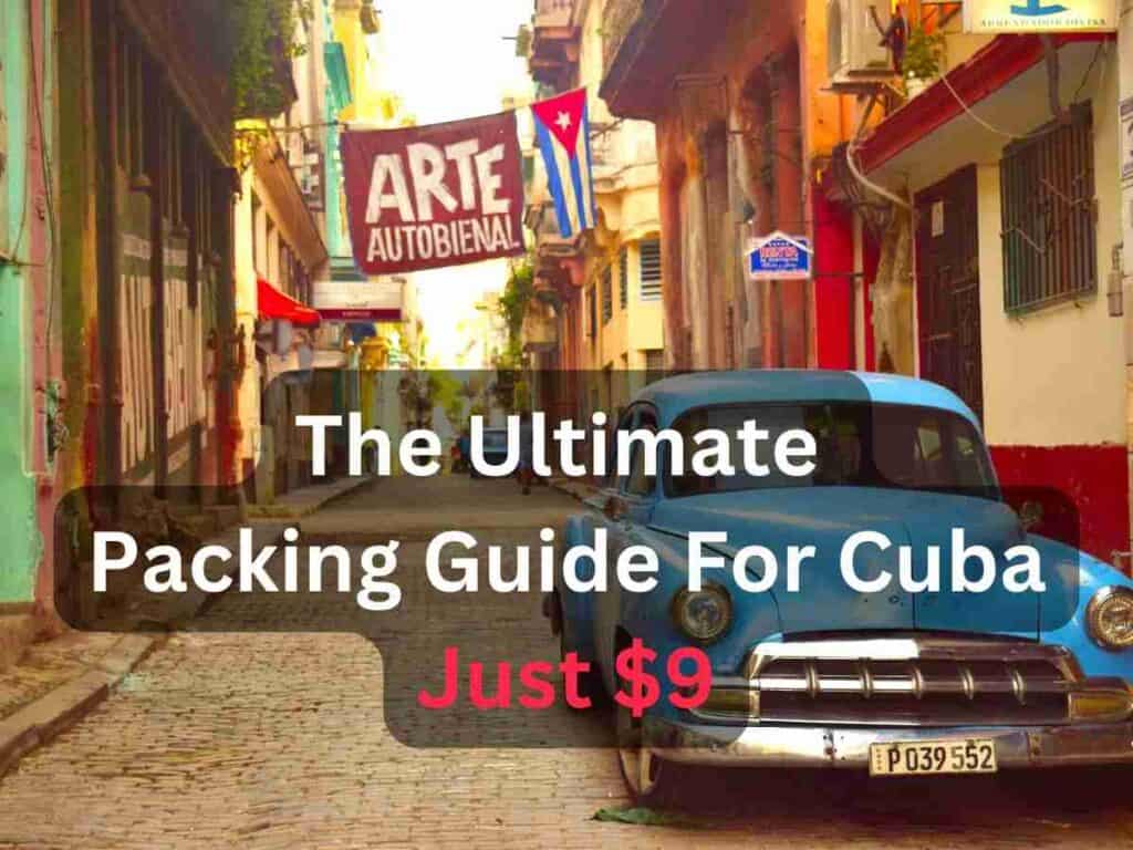 A classic American car parked in a narrow street in Cuba surrounded by classic colonial buildings