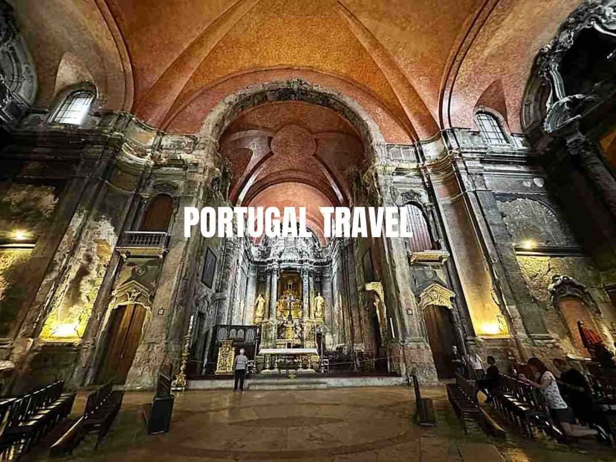 The vast beautiful hall and ceiling of a cathedral, with warm terracotta and golden colors, lots of artwork columns and arches