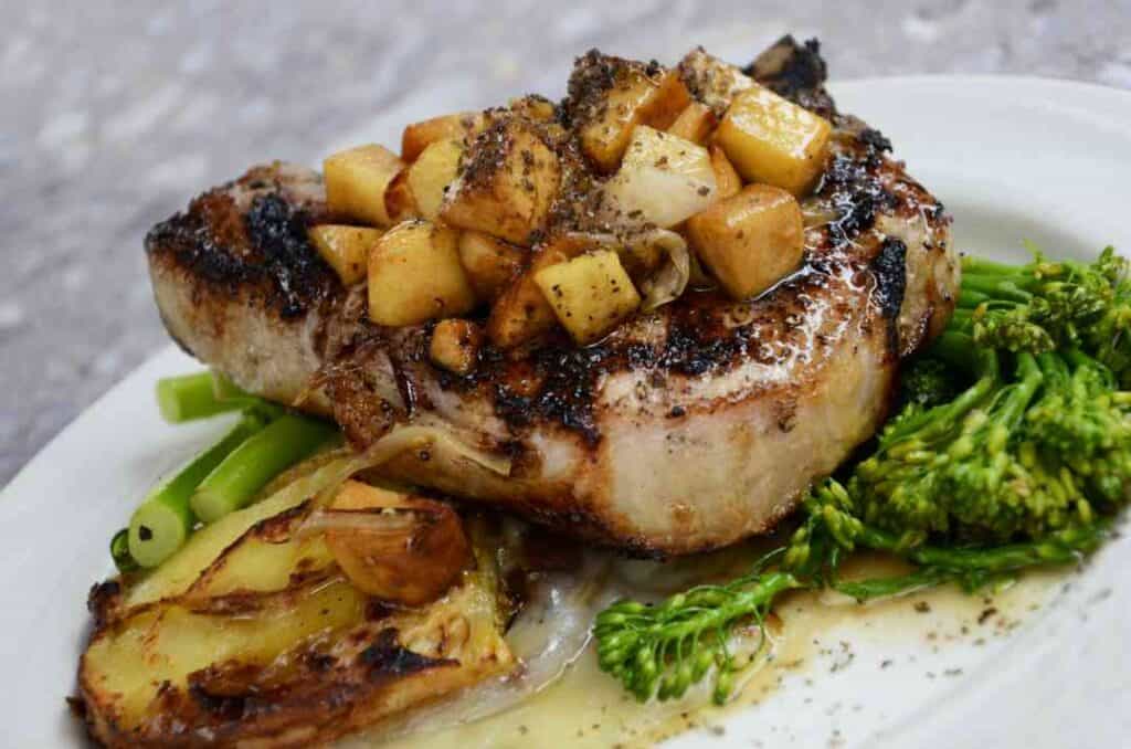 Close up photo of a served rig steak with leek, vegetables and potato looking delicious 