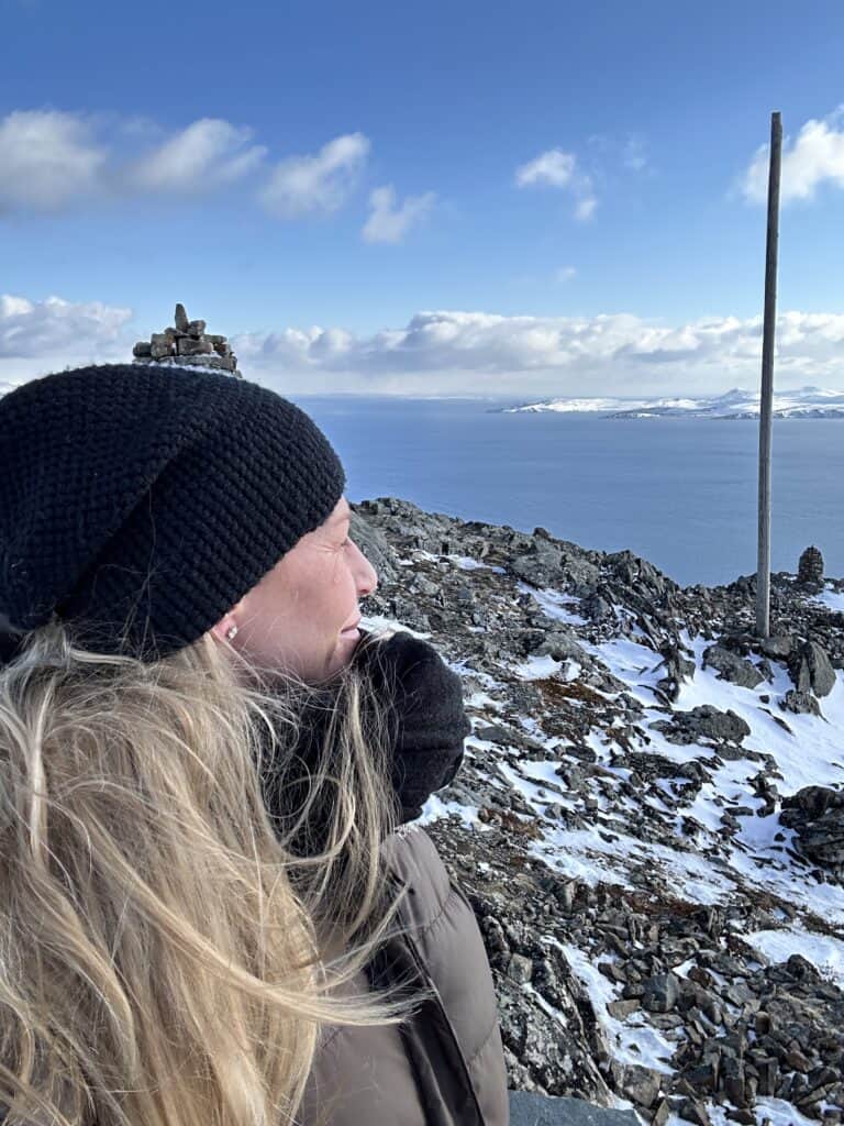 Woman on a mountain for itinerary service at Epic Nomad Life